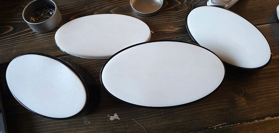 Group of 3 oval Piercing Displays with White Silicone pads to hold the jewelry.