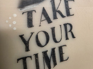 Tattoo Practice Skin with White and Black Ink, that says "Take Your Time"