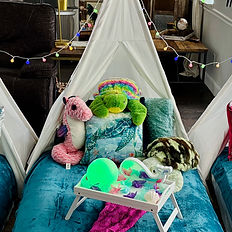 Close up photograph of one of three teepees with a seahorse and multiple sea turtles