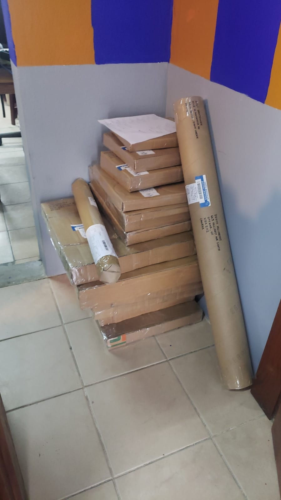 Belizean postal service hard at work; delay in shipping paintings