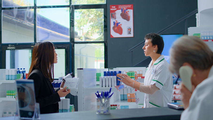 shopper-chemist-store-asking-pharmacist-medical-expertise-while-cashier-talks-phone-checko