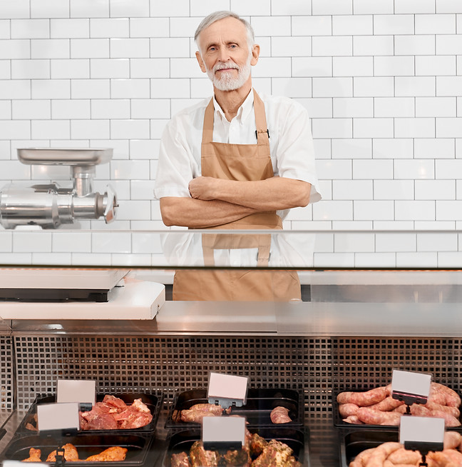 male-butcher-posing-counter.jpg