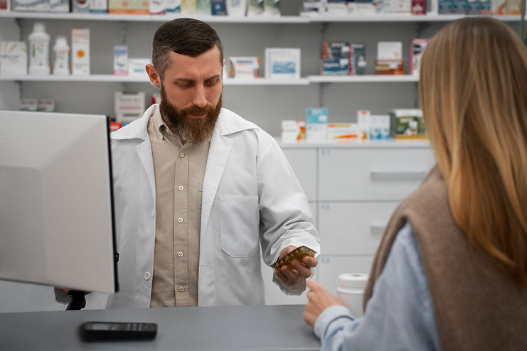male-pharmacist-consulting-female-customer-drugstore.jpg