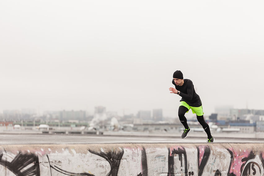 man-sprinting-rooftop.jpg