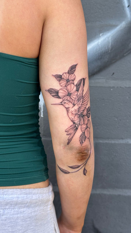 Dainty floral and Hummingbird tattoo done by Alex Meza Tattoos in downtown Fresno