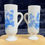 Thumbnail: 2-pc Set 1960s Avon Milk Glass Demitasse Cups with Blue French Toile Design