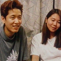 A Japanese trans man named Tatsu, sitting with his girlfriend
