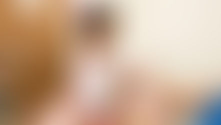 A nurse puts a band-aid on a young girl's shoulder.