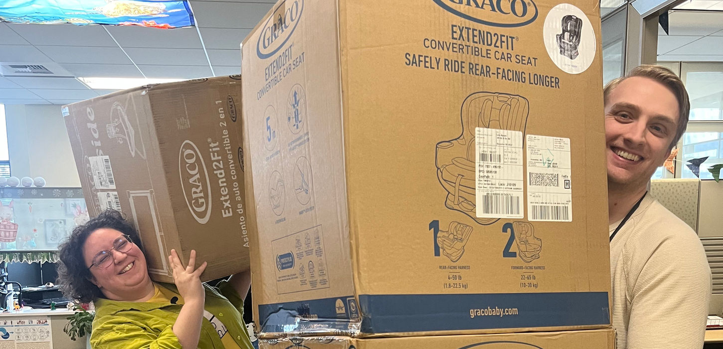 KPHD employees holding large boxes