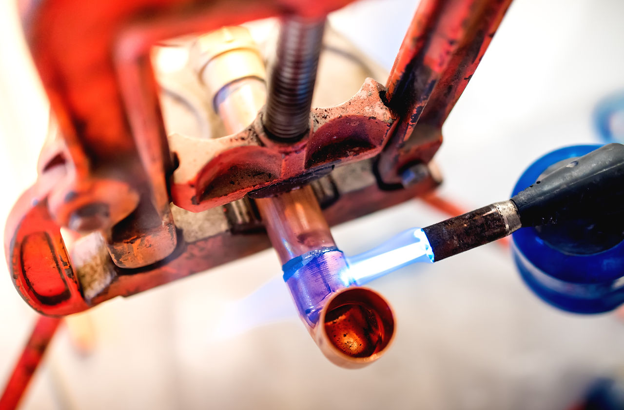 industry-professional-plumber-welding-an