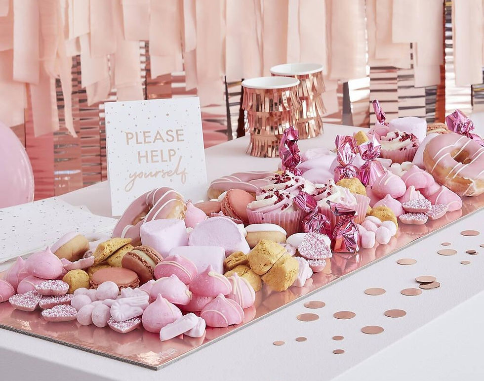 A table adorned with pink confetti and donuts, part of a French bridal shower with special treats and delicacies.