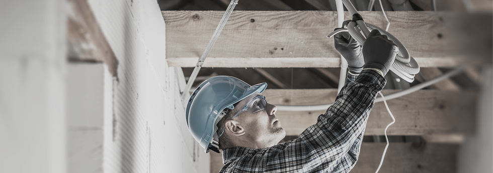 Professional Caucasian Electrician Working on Electrical Wiring System Installation in New