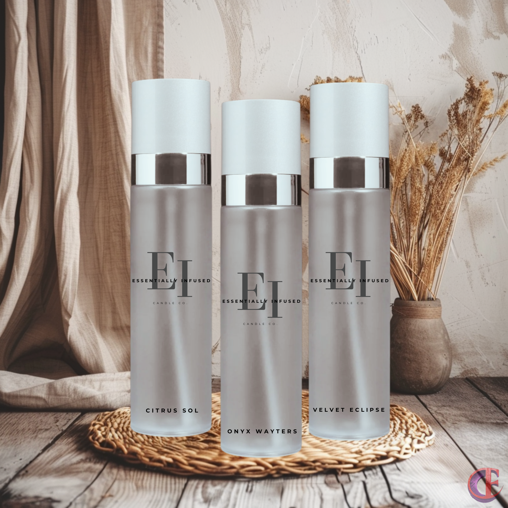 Three Essentially Infused luxurious room sprays displayed on a rustic woven tray with warm, earthy décor in the background.