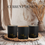 Thumbnail: Three Essentially Infused luxury candles displayed on a rustic woven tray with warm, earthy décor in the background.