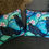 Thumbnail: Starlings Cushion 40cm x 40cm. Feather pad. Batik design printed on chenille.