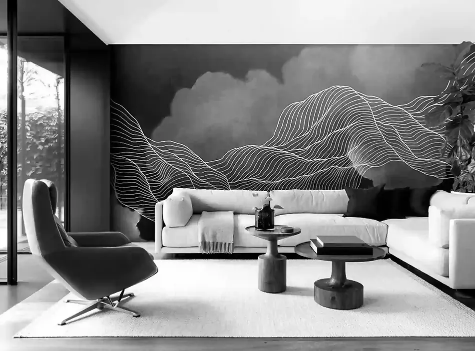 black and white image of contemporary residential sitting room next to a patio garden with white sofas, behind is a large scale feature wall art with organic notes of gold leaf made by artelier
