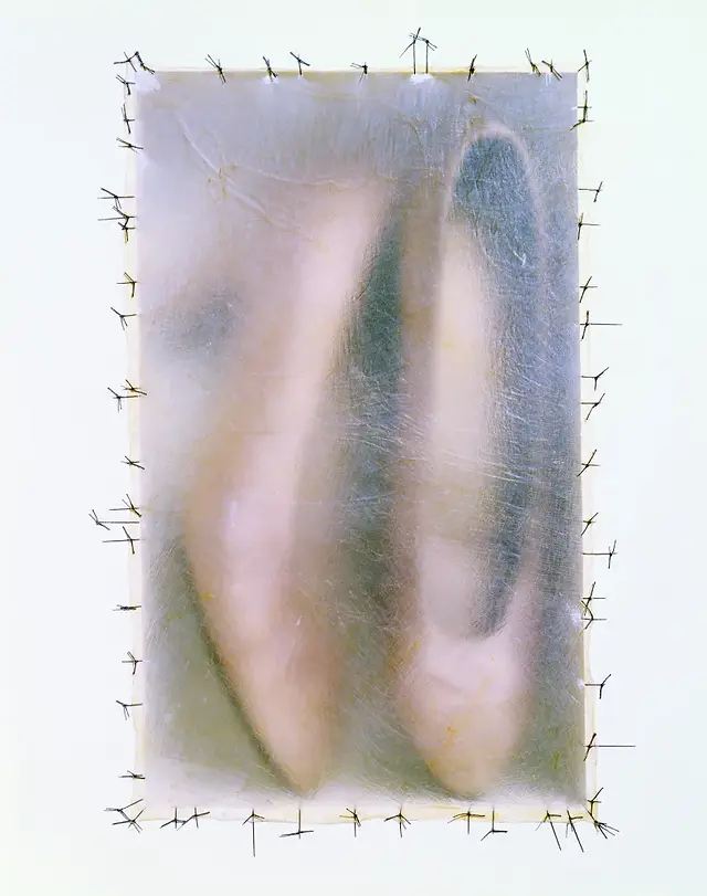 shoes blurred in a box with crosses surrounding the rectangular frame