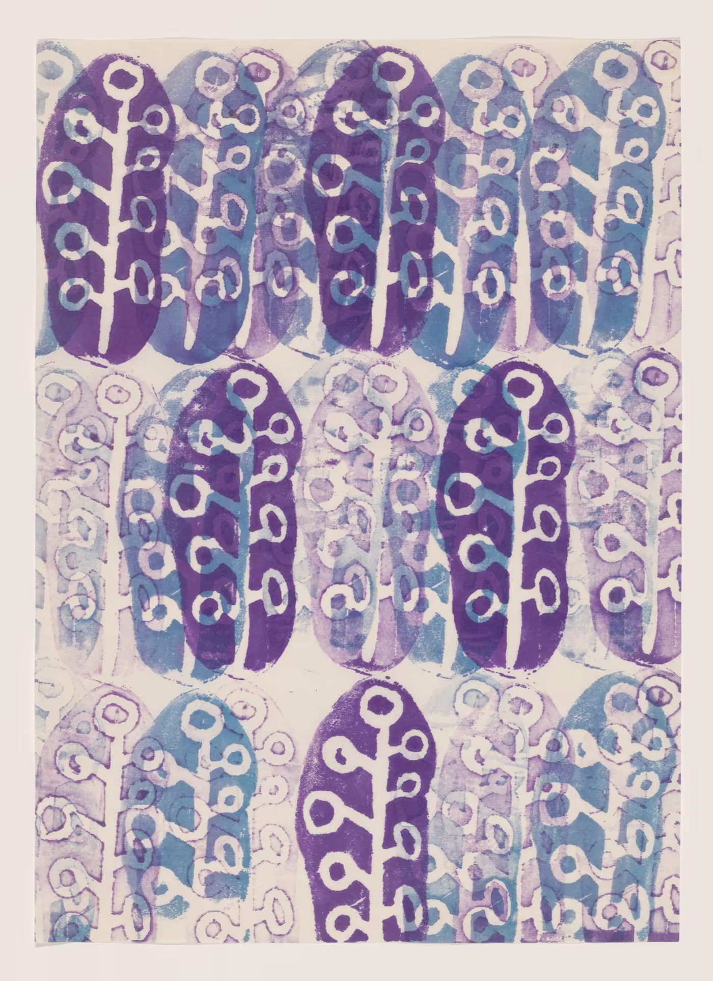 The image features a pattern of stylized plant-like shapes. The shapes are arranged in even rows across the frame, with an alternating scheme of blue and purple. The shapes each feature a slightly rounded top and a stem-like bottom, with circular figures branching out of the side. Due to the translucent effect of the prints, the colors combine to a small degree, creating slight variations in shade. The background is a neutral tone, which allows the pattern to stand out. The print appears to be created with block printing techniques, as the strokes are unevenly distributed, suggesting hand-printing.