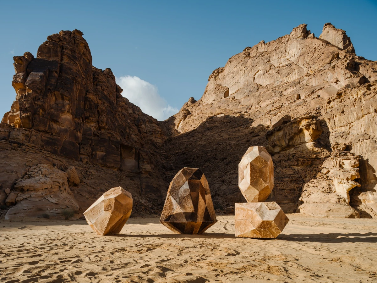 © Photo by Barbara Picci depicting 4 geometric egg style shaped large abstract contemporary art installation in the middle of desert x installation in alula made of camel hair