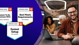 Man smiling in an office setting with colleagues in the background. Awards on the left say G2 Spring 2026, Easiest To Do Business With, Easiest Setup and Best Meets Requirements for intranet software provider