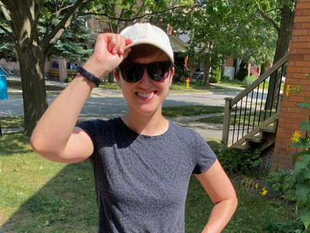 woman outside wearing a cap