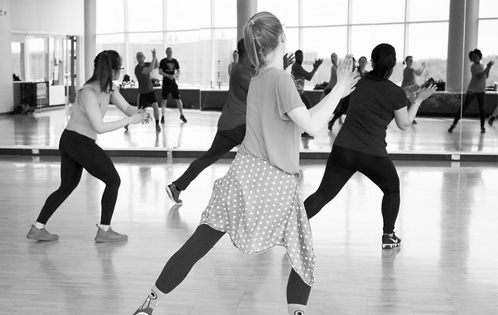 women dancing near mirror_edited.png