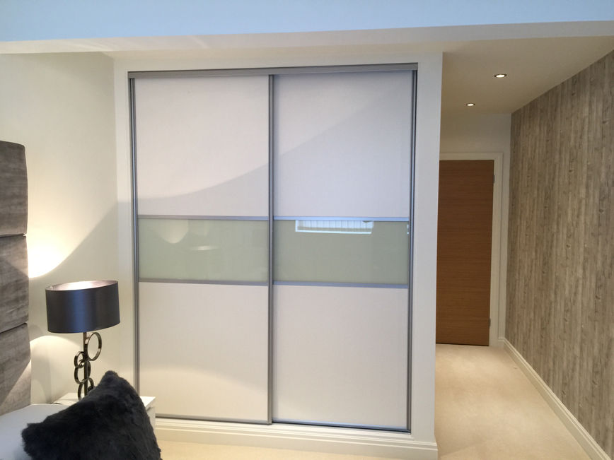 These stylish doors are aluminium framed with matt white panels and a plain, opaque glass centre panel.