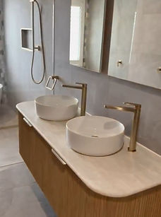Dual basin vanity with wall-mounted cabinet installed during bathroom upgrade by CH Plumbing Projects
