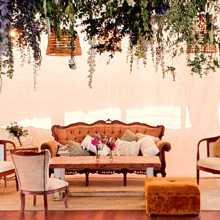 Caramel and white lounge suite with linen backdrop pacific palms slsc