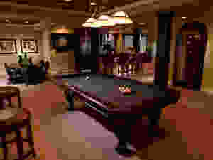 Finished basement with billiard table, bar & wine cooler