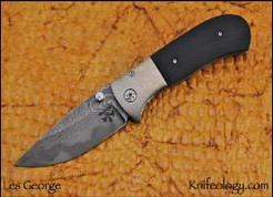 FM1 Bolsterlock, SanMai Damascus, Black G10, Orange Peel Ti Bolster