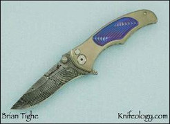 Tighe Coon Button lock Flipper, Damasteel, Faux Ti Inlay
