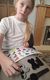 Photo of a child using PRIOR looking happy.