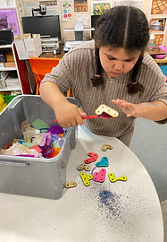 Photo of a child using PRIOR looking happy.