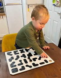 Photo of a child using PRIOR looking happy.
