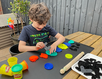 Photo of a child using PRIOR looking happy.