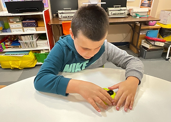 Photo of a child using PRIOR looking happy.