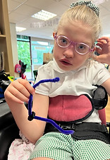 Photo of a child using PRIOR looking happy.