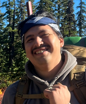Photo of Alberto Q in the field hiking.