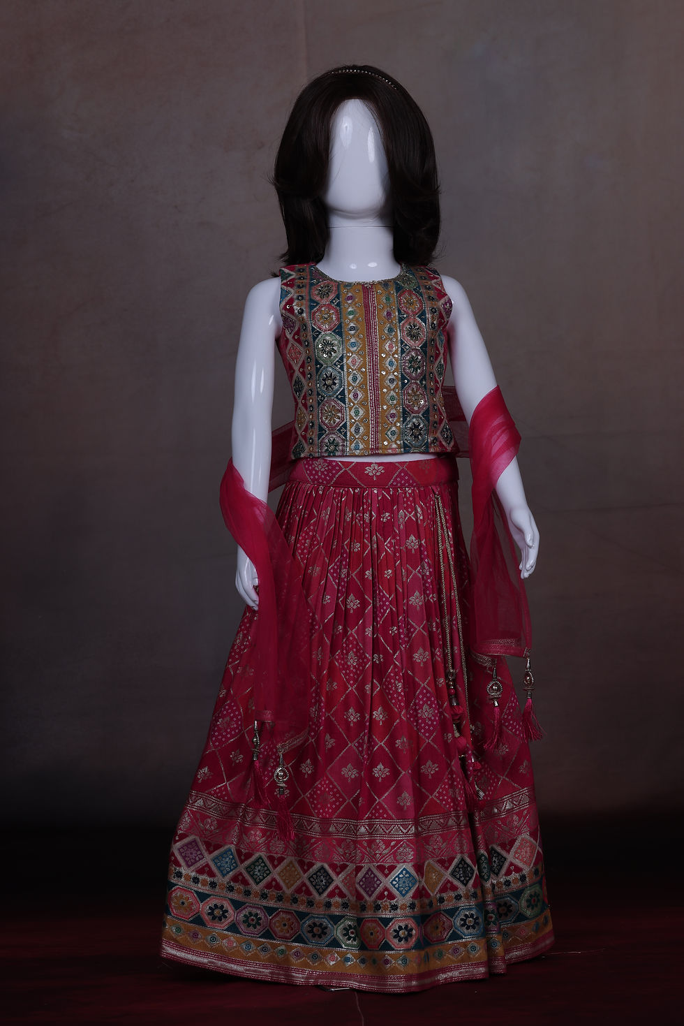 Girls' Rani Pink Banarasi Brocade Lehenga with a heavily woven silk skirt and an opulent multi-color embellished crop top.