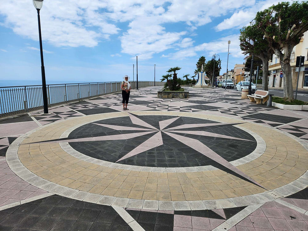 tile pattern of compass on the Lungomare in Diamante haveityourwayholidays