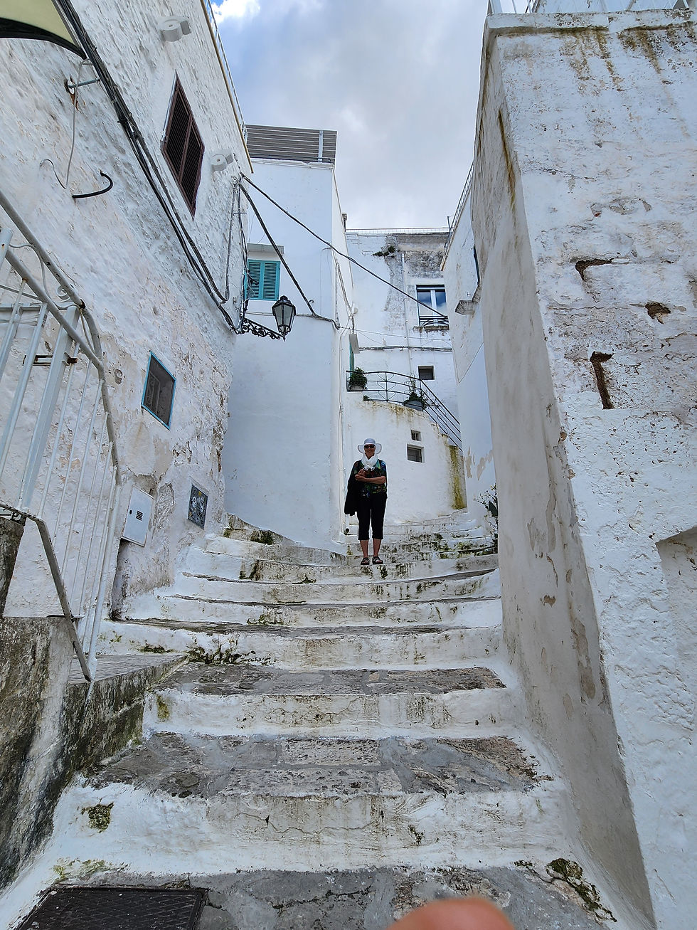 Tina stair climbing in Ostuni.