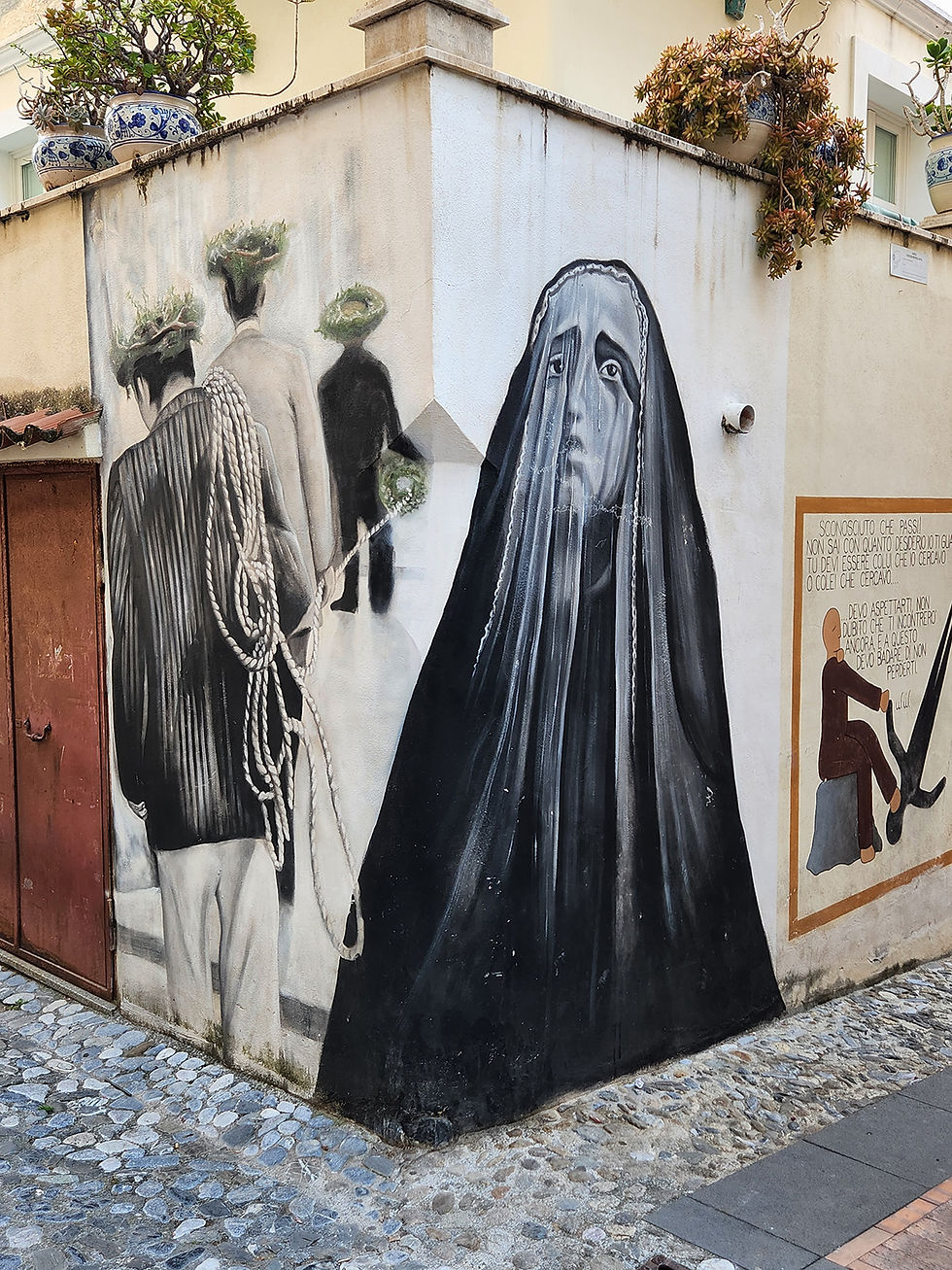 religious influenced mural on street corner in Diamante Italy