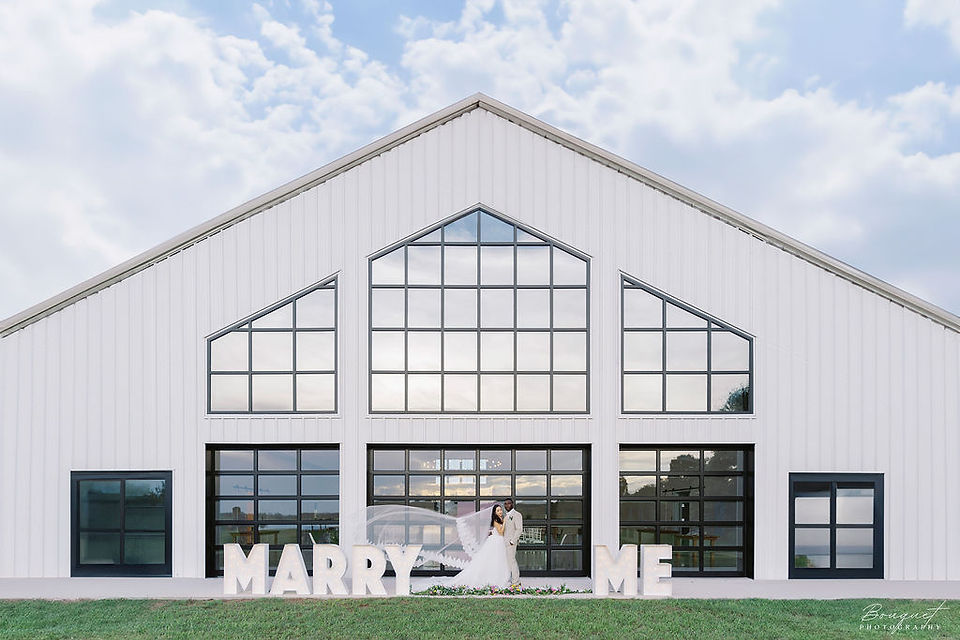 lavender-on-the-lake-outdoor-space-with-newlyweds-kissing