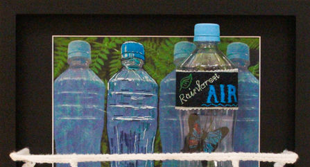 Plastic bottles with rainforest background.