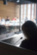 woman translating in translators cubicle.jpg