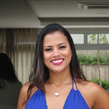 Ully Carolinne Sampaio smiles at the camera.