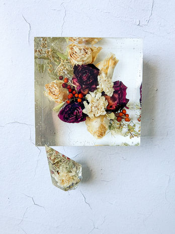 Air dried wedding flowers in a 6x6 acrylic resin block with large ring holder.