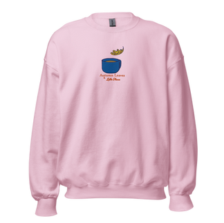 Light pink Eden Cafe sweatshirt featuring embroidered blue mug, falling oak leaf, and the phrase ‘Autumn Leaves & Latte Please’ — cozy and colorful fall apparel.