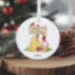 Ceramic round Winnie the Pooh Christmas bauble for baby's 1st Christmas personalised with a name